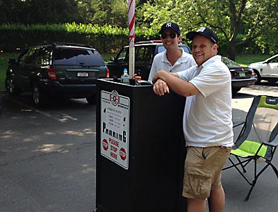 Joe Donohue, left, an attendant, and Mike Goldsmith, a supervisor, manned the new parking hurdle in Amagansett Square last week.