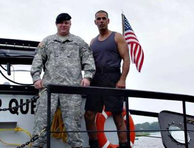 John Re, right, with an unidentified man aboard his Deep Quest submarine, in a 2006 image from the Belleair Bee newspaper in Florida