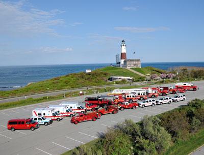 The Montauk Fire Department recently assembled its trucks and ambulances for a photograph at the Lighthouse. It will be joined by a number of other departments for a 75th anniversary parade on Saturday.