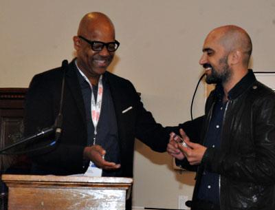 Shlomi Elkabetz, co-director and co-writer of “Gett: The Trial of Viviane Amsalem,” accepted congratulations from Patrick Harrison, a juror, for winning the Golden Starfish Narrative Feature Award.