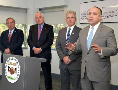 Jeffrey Grybowski, at right, pledged to create jobs on Long Island to support the construction of the Deepwater One offshore wind farm. With him were, from left, John Durso of the Long Island Federation of Labor, Dick O’Kane of the Nassau-Suffolk Construction and Building Trades Council, and Suffolk County Executive Steve Bellone.