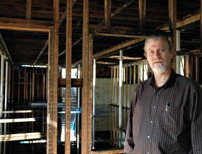 The Rev. Steven Howarth stood in the burned-out basement of Scoville Hall last month. The building, destroyed by fire in 2011, was demolished on Tuesday.