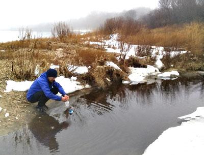 Jay Levine, a member of the board of Concerned Citizens of Montauk, took a water sample earlier this year in a creek that drains into Lake Montauk.