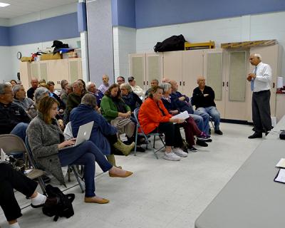 Pio Lombardo, standing at right, a consulting engineer, discussed a proposal to create a centralized wastewater treatment system for downtown Montauk properties at a meeting of the Montauk Citizens Advisory Committee on Monday night.