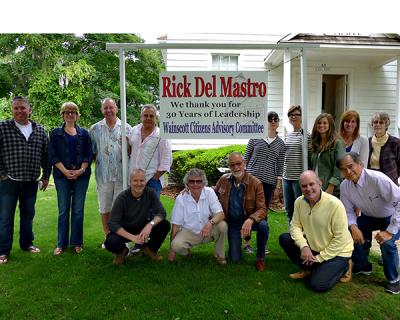 The members of the Wainscott Citizens Advisory Committee erected a sign to thank one of its members, Rick Del Mastro, kneeling at center, for 30 years of service to the committee.