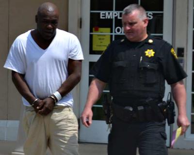 Bronte O’Neal, center, was arraigned in Riverside Wednesday on felony charges in the alleged assault of an 83-year-old Northwest Woods woman and stealing her car on May 30.