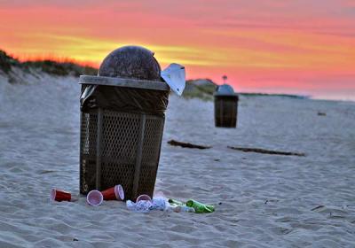 Critics of beach garbage cans, including the East Hampton Town Trustees, say that cans like these on Main Beach create more problems than they solve.