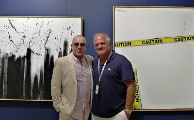 Bernie Taupin, left, and Mark Borghi shared a moment together in the Borghi booth at Art Southampton during last Thursday night’s “platinum V.I.P. preview.”