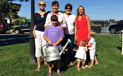 Members of the Sag Harbor Ladies Village Improvement Society — Gail Brown, Bethany Deyermond, Diane Lewis, and Amity Lucas, with her two kids, Hudson and Lana, and Sophia Deyermond in front — gathered on Long Wharf.