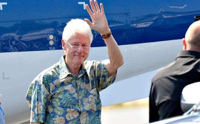 Bill Clinton arrived at East Hampton Airport on Sunday. Hillary Rodham Clinton was expected in town on tomorrow.