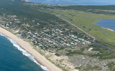 A resident of Dolphin Drive, a street on a narrow portion of Napeague, has sued East Hampton Town to prevent cars from parking on his road, which he says will lead to degradation of dunes and place his neighborhood in danger of flooding.