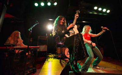 Lez Zeppelin, founded by Steph Paynes, center, delivers a high-energy set of Led Zeppelin’s music.