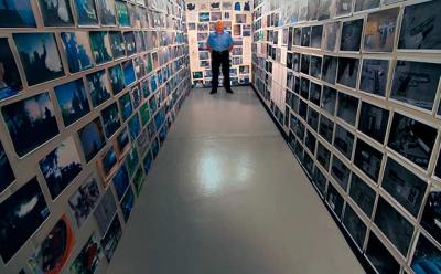 William (Dub) Lawrence filled a corner of his airplane hangar with evidentiary photographs as part of his personal investigation into the death of his son-in-law.