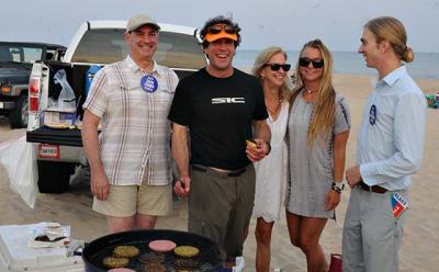 Democratic and Independence Party candidates for East Hampton Town trustee — Zachary Cohen, Rick Drew, and Tyler Armstrong — grilled up hamburgers and veggie burgers with help from Susan and Carly Drew during a beach party at Atlantic Avenue in Amagansett Sunday.