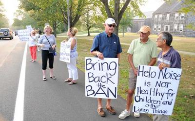 After picketing outside Town Hall last Thursday night, residents affected by aircraft noise told the town board an overnight curfew this summer gave limited relief and urged continued efforts.