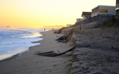 Earlier this week people walked along a narrow strip of dry sand on the downtown Montauk beach, where the Army Corps of Engineers is set to commence construction of a sandbag-filled artificial dune.