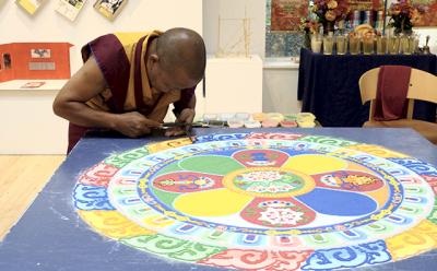 Tenizn Yignyen, a Tibetan Buddhist monk, constructed a sand mandala to teach students at the Ross School the importance of compassion and a good heart.