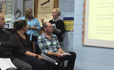 Jodie Hallman, standing at left, and Susan Harder, at right, presented the recommendations of the Springs School facilities committee on Monday night, which included adding modular classrooms to solve the district’s immediate space needs.