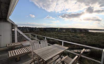 Sunsets and cloudscapes over Montauk’s Fort Pond Bay dominate the outdoor deck.