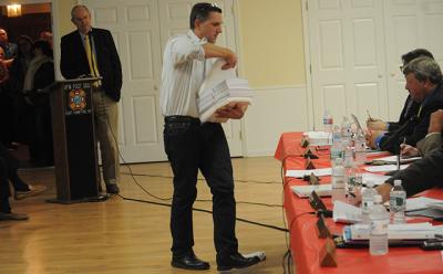 Tom Steele, an active opponent of a proposal to establish a rental registry in East Hampton Town, distributed information to the town board at a hearing on the proposal last week.