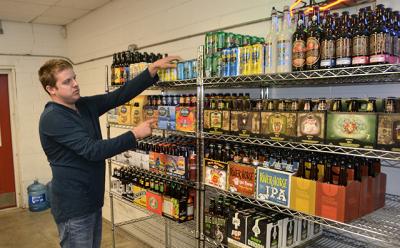 Brendan Worrell stocked the shelves last week at the beer and beverage store on Pantigo Place in East Hampton, soon to be called Hampton Beverage East.