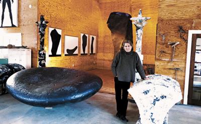 Two large bronze stones, left and rear, and four C-prints were among the works in Ned Smyth’s Shelter Island studio during a recent visit.