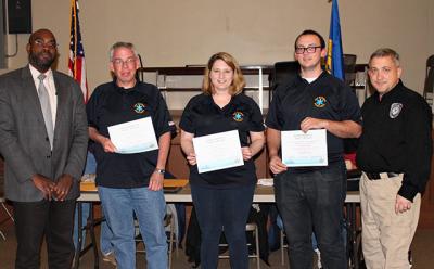 An ambulance crew from Sag Harbor were honored at a recent meeting of the Suffolk County Regional Emergency Medical Services Council. From left, Dr. Gregson Pigott, the E.M.S. medical director, with Joel Vetter, far right, helped honor the Sag Harbor volunteers, that included Eddie Downes, Denise Schoen, and Mike Stone.