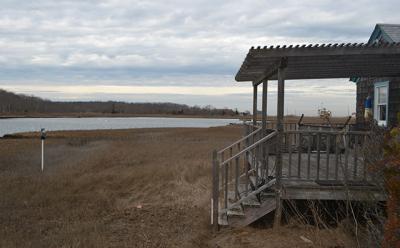 Neighbors of a Gerard Drive cottage have said that a planned house there would be the environmentally sensitive Springs peninsula’s “first McMansion.”