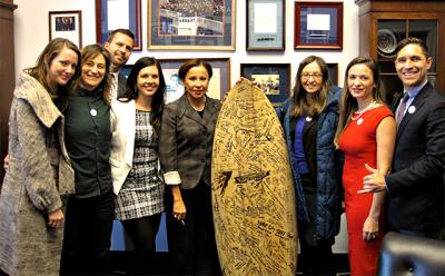 Representative Nydia Velazquez, center, was visited by, from left, Amanda Moore, Sommyr Pochan, Matt Gove, Nikita Scott, Joanna Malaczynski, Nicole Delma, and Jesse Spooner of the Surfrider Foundation. The group traveled to Washington last month to lobby for measures to protect the oceans and coastal areas.