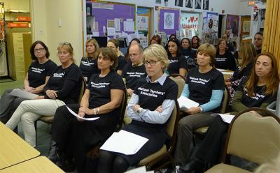 Teachers from the Montauk School wore black T-shirts to a school board meeting Tuesday to call attention to the fact that they’ve been working without a contract since July.