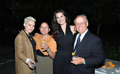 Bernard Kiembock, right, can often be seen on the summer benefit circuit sharing his family’s Dona Sarita mezcal with guests such as Kristin Houdlett, center. His daughter, Rebecca, and his wife, Sara Kiembock, are at left. The mezcal is best served with lime and orange juice in a chile salt-rimmed glass, according to the family.