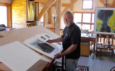 Dan Welden examined a portfolio of Solarplate prints in his mezzanine studio in Noyac.