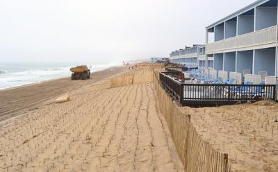 Beach grass planted in straight rows atop a buried sandbag wall on Montauk’s downtown beach will be fenced off and pedestrian access to the shore allowed only over wooden walkways at four different oceanfront spots.