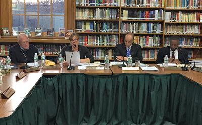 From left, Tim Frazier and Liz Mendelman, the Springs School Board vice president and president, both voted to adopt the proposed 2016-17 budget after John J. Finello, the superintendent, and Carl O. Fraser, the interim business administrator, briefed the board on Monday.