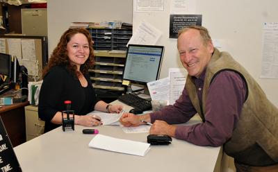 Alexander Peters of Amagansett, who raised questions about East Hampton Town’s rental registry before it became law, listed his property yesterday with the town Building Department with the help of Evelyn Calderon.