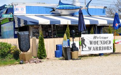 A new stockade fence will prohibit customers at Cyril’s Fish House, the popular roadside bar on Napeague, from spilling out onto the highway, as part of an agreement between owners of the property and the town.