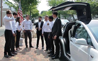 Staffers at the Tesla Motors gallery on Newtown Lane prepared to welcome visitors as a Model X sport utility vehicle stood ready for inspection and test drives.