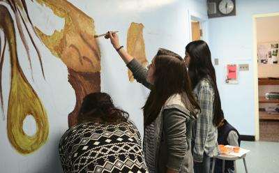 Students from East Hampton High School returned to the Springs School to paint a mural, under the auspices of the Anna Mirabai Lytton Foundation.