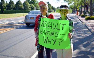 Nicki Mazur, right, and Arlene Coulter were among the dozen at a rally along Montauk Highway in Water Mill to ban assault weapons. The East Hampton and Southampton Town Democrats were the sponsors.