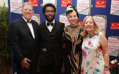 From left, Marty Cohen, the chairman of Guild Hall, Arcmanoro S. Niles, Iris Smyles, and Michele Cohen enjoyed Ms. Smyles’s breakfast book launch gala very much, Econo Lodge lobby setting be damned.