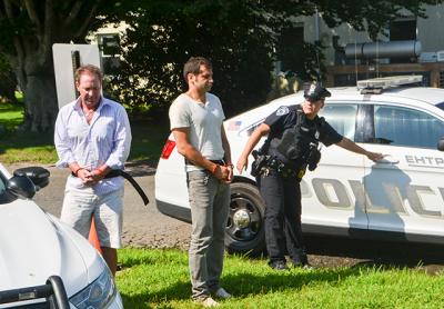 Chris W. Layton, left, and Sahm Adrangi, center, appeared in East Hampton Town Justice Court on Saturday following their drunken-driving arrests.