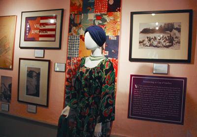 At least one of the dresses in the exhibition, above, should have a knotted opera-length pearl necklace, which Sara Murphy wore down her back as a signature look.  Gerald Murphy’s Chinese dragon robe, below, looks as vibrant as it did when he wore it.