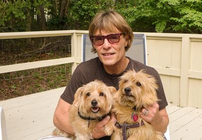 Patrick Christiano took in a late summer afternoon on his deck with Franki, left, and Tallulah.