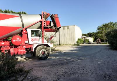 A cement truck pulled out of an industrial site in Wainscott on Tuesday in a commercial area that would be subject to a one-year building moratorium while East Hampton Town completes a planning study.