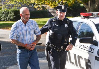 Dennis E. McGuire of East Hampton was arrested Monday by town police on a felony charge stemming from an incident Saturday in which he allegedly videoed a young woman showering in his home on Oakview Highway.