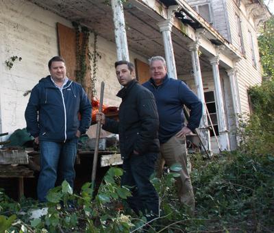 Mitch Winston and his brokers Christian Lipp, left, and Scott Strough, right, surveyed the property at 6 Union Street in Sag Harbor for the first time yesterday since Mr. Winston and a partner closed on their purchase of the house.