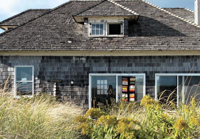 A modest cottage on the beach in Bridgehampton inspired two artists to respond to its likely razing, placing an installation of objects around its exterior.