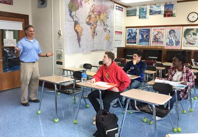 John Reilly, a Bridgehampton School teacher, has dedicated much classroom time to discussing the presidential election with his students, including, from left, Max Cheng, Raymond Maldonado, and Nia Dawson.