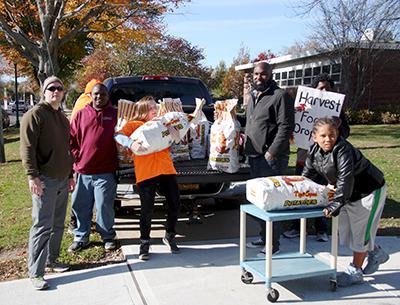 Strong volunteers lent a hand moving the 50-pound bags of potatoes donated to the East Hampton Food Pantry’s Harvest Food Drive by Foster Farm of Sagaponack on Saturday.