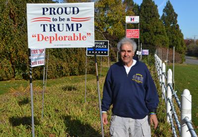 “I think Trump is going to surprise you. You have to give him a chance,” said Andy Sabin of Amagansett, posing near his collection of Trump lawn signs.